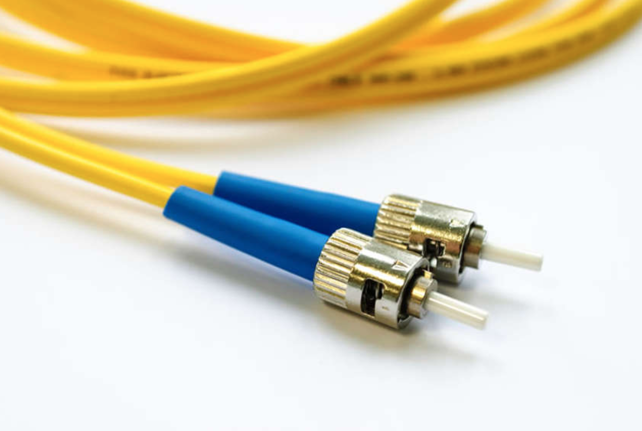 The image shows two fiber optic cables with a b n c connector and an approximate one inch white core sticking outward.